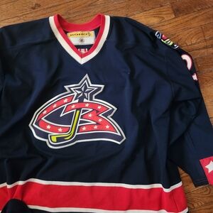 Blue Columbus Blue Jackets Hockey Jersey with Red & White Accents